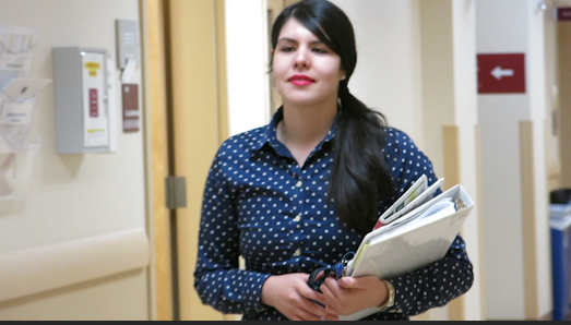 photo - Edith Gonzalez walking through campus